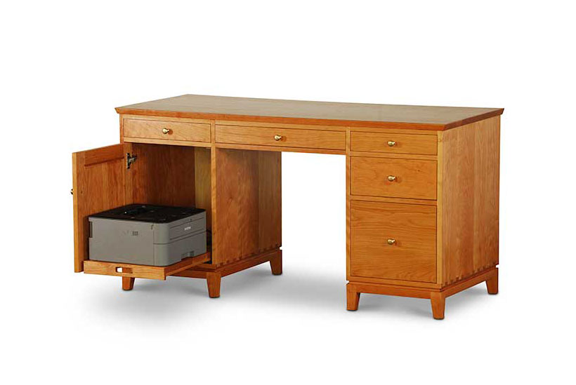 Double Pedestal Desk in Cherry with one drawer and cabinet with printer pull out shelf on left, center drawer, two drawers and file drawer on right, all with brass knobs