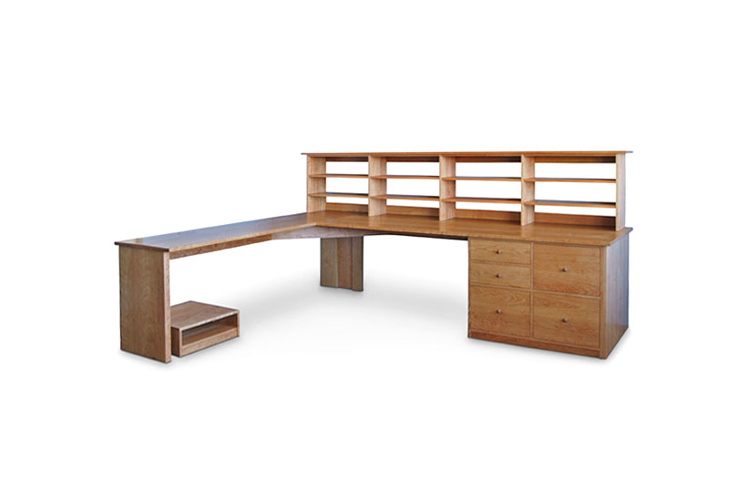 Large Workstation with two drawers and three file cabinets on right, open shelving hutch top on right